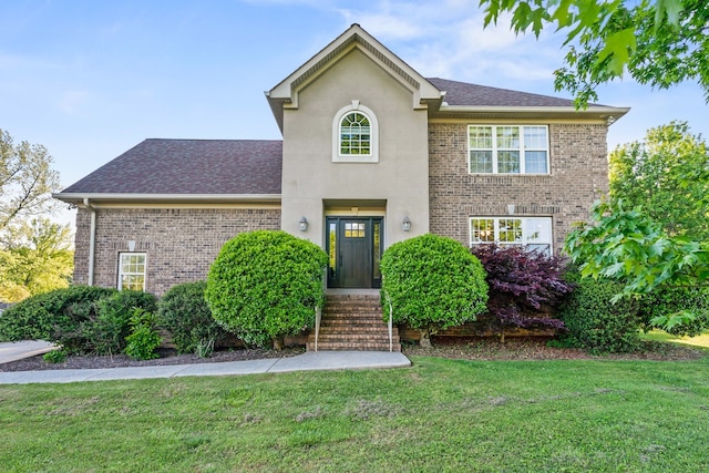 front facade with a front yard