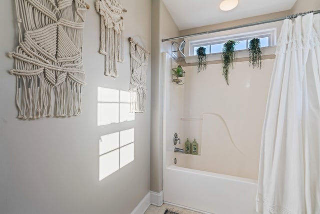 bathroom featuring shower / bath combo with shower curtain