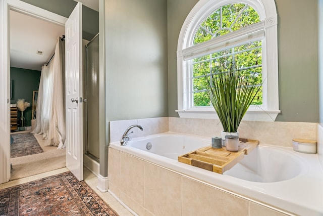 bathroom featuring tiled bath