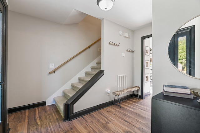 foyer entrance featuring dark hardwood / wood-style flooring