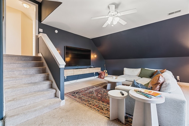 living room with carpet, ceiling fan, and lofted ceiling