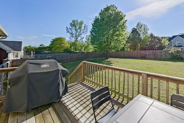 deck with a yard and a grill