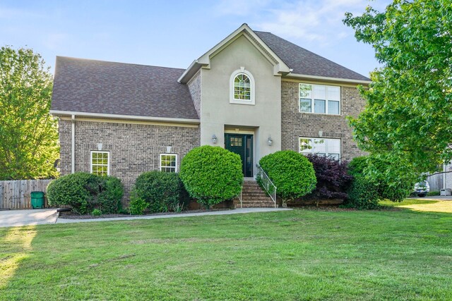 view of front of house with a front lawn