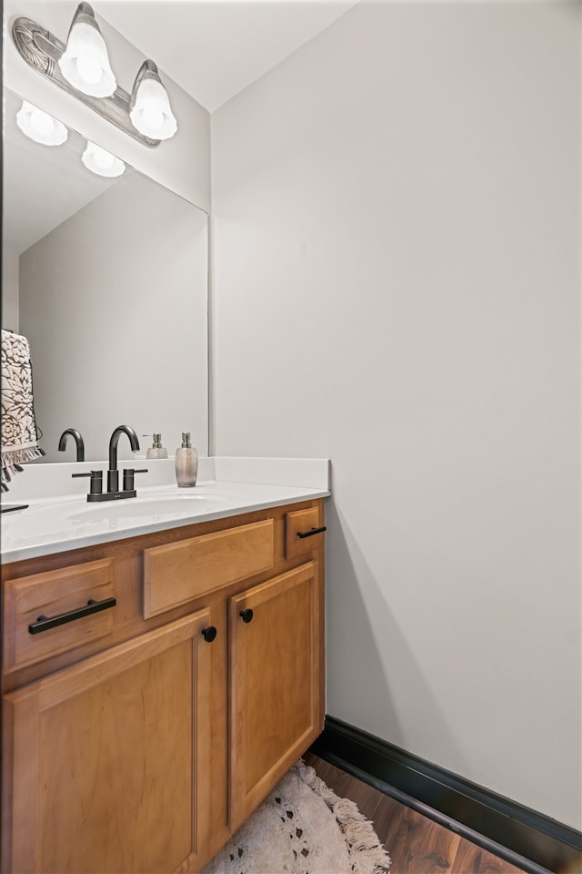 bathroom featuring vanity and wood-type flooring