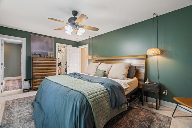 carpeted bedroom with ceiling fan