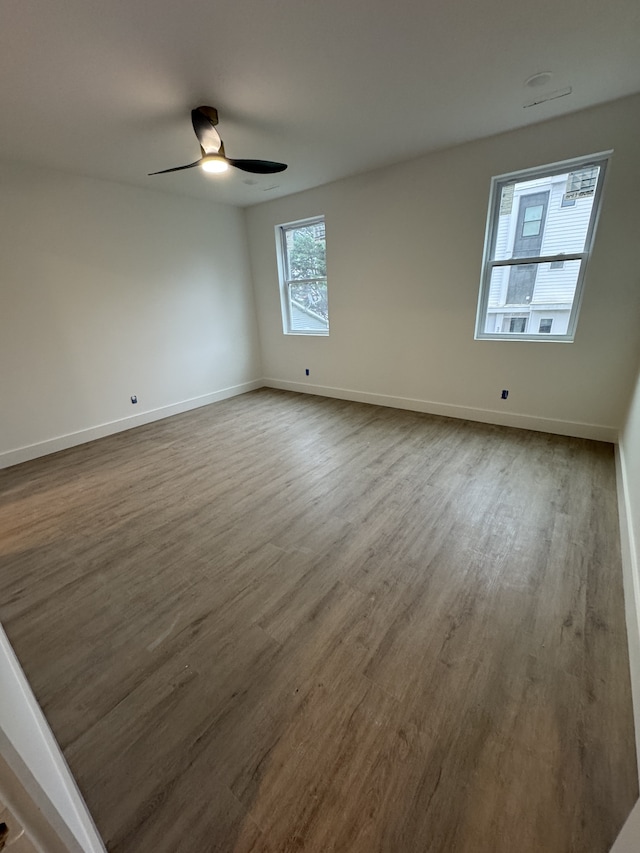 unfurnished room featuring wood-type flooring and ceiling fan