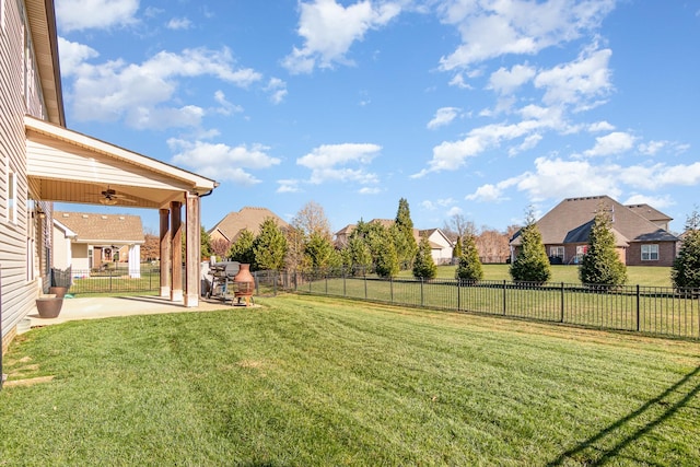 view of yard featuring a ceiling fan, a residential view, a patio area, and a fenced backyard