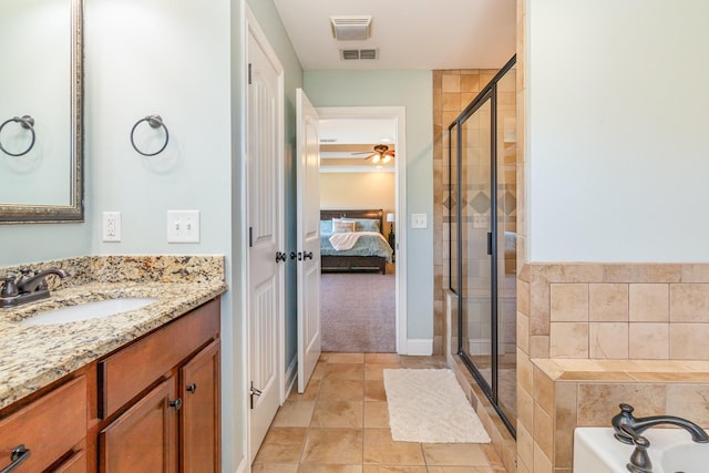 bathroom with a stall shower, visible vents, vanity, and ensuite bathroom