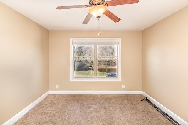 unfurnished room with light carpet, ceiling fan, and baseboards