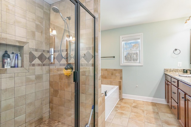 bathroom with vanity, baseboards, a bath, tile patterned floors, and a stall shower