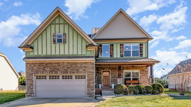 view of front of house featuring a garage and a front lawn