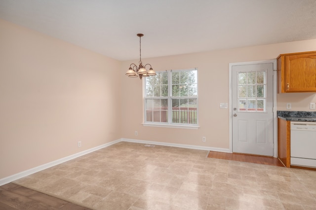 unfurnished dining area with light hardwood / wood-style floors and a notable chandelier