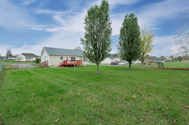 view of yard featuring a wooden deck