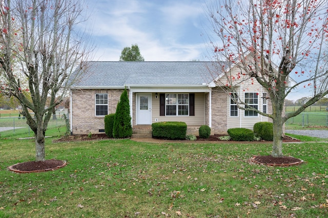 single story home featuring a front lawn