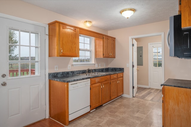 kitchen with sink, electric panel, white dishwasher, a textured ceiling, and light wood-type flooring