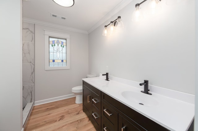 bathroom with walk in shower, ornamental molding, vanity, wood-type flooring, and toilet