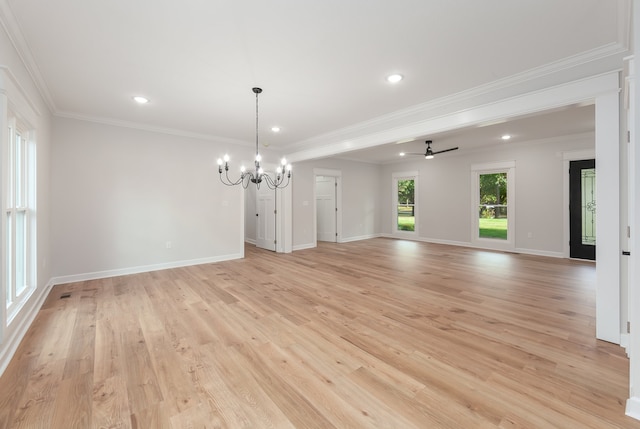 unfurnished room with ornamental molding, ceiling fan with notable chandelier, and light wood-type flooring