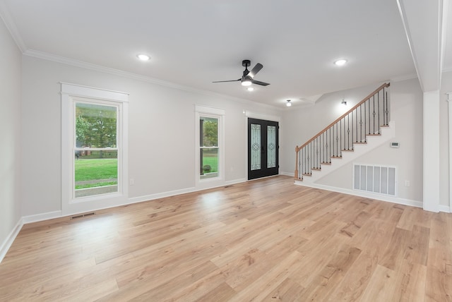 unfurnished living room featuring ceiling fan, french doors, ornamental molding, and light wood-type flooring