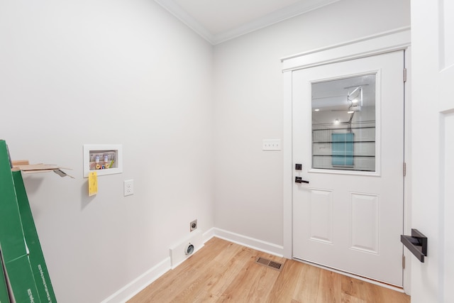 laundry room with electric dryer hookup, hookup for a washing machine, light hardwood / wood-style flooring, and ornamental molding