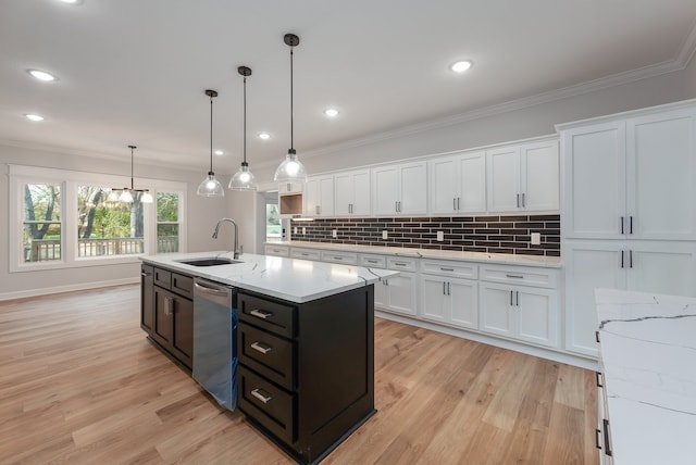 kitchen featuring sink, light hardwood / wood-style flooring, dishwasher, white cabinetry, and hanging light fixtures