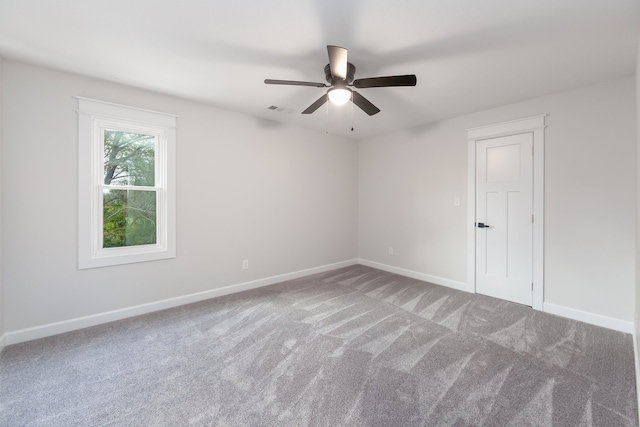 unfurnished room with carpet flooring and ceiling fan