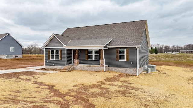 view of front of house featuring covered porch and central air condition unit