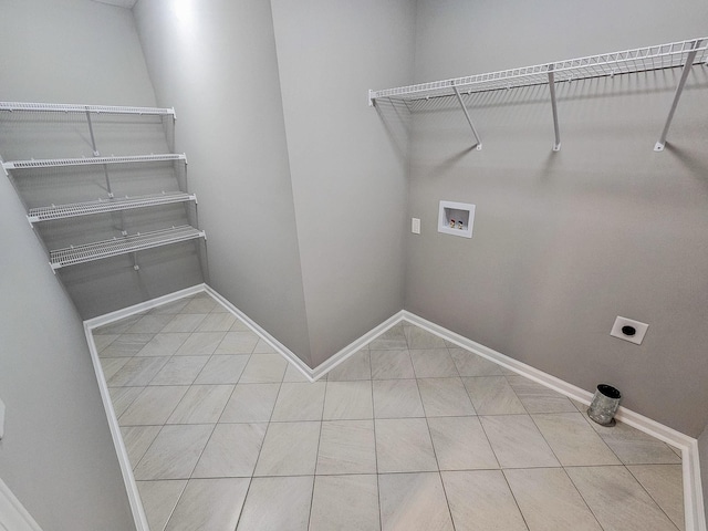 washroom with tile patterned flooring, electric dryer hookup, and washer hookup