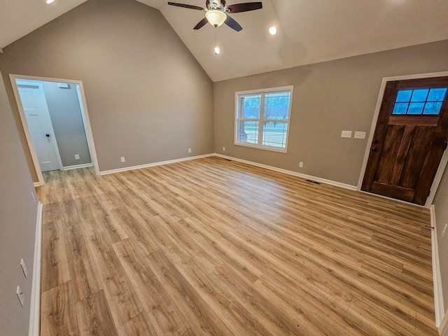 unfurnished living room with light hardwood / wood-style flooring, high vaulted ceiling, and ceiling fan