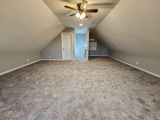 additional living space with ceiling fan, lofted ceiling, and carpet floors