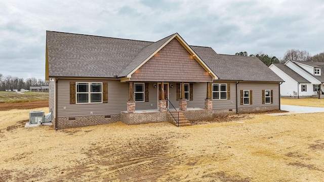 craftsman-style house with cooling unit and covered porch