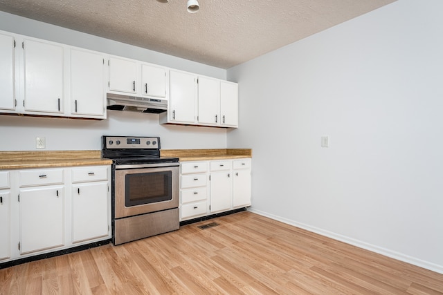 kitchen featuring white cabinets, a textured ceiling, light wood-type flooring, and stainless steel range with electric cooktop