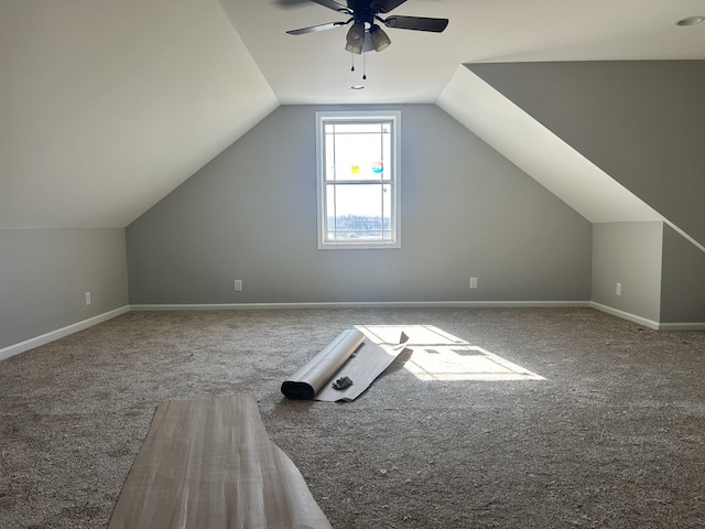 additional living space with carpet, lofted ceiling, and ceiling fan