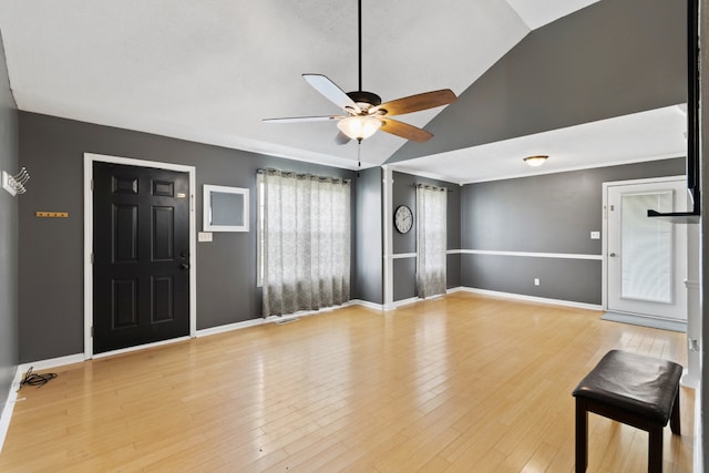 unfurnished living room with ceiling fan, light hardwood / wood-style floors, and vaulted ceiling