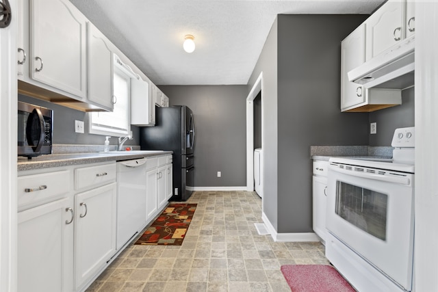 kitchen featuring white appliances, exhaust hood, white cabinets, sink, and a textured ceiling