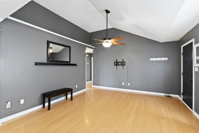 unfurnished living room with light hardwood / wood-style flooring, ceiling fan, and lofted ceiling