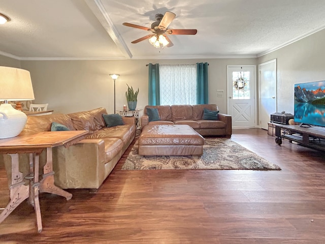 living room with crown molding, ceiling fan, and wood finished floors