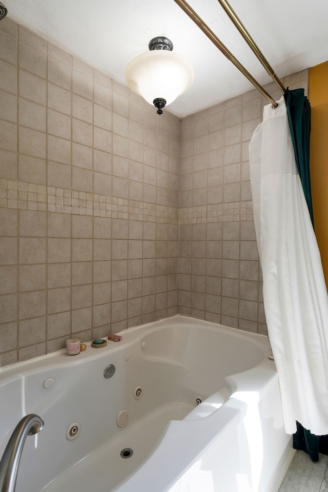 bathroom with shower / tub combo with curtain