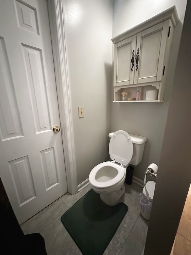 bathroom featuring tile patterned flooring and toilet