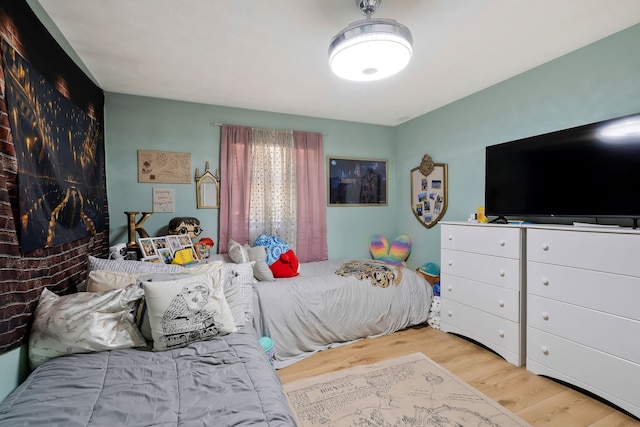 bedroom with light wood-type flooring