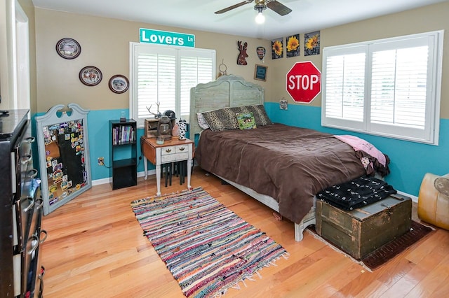 bedroom featuring ceiling fan and hardwood / wood-style floors