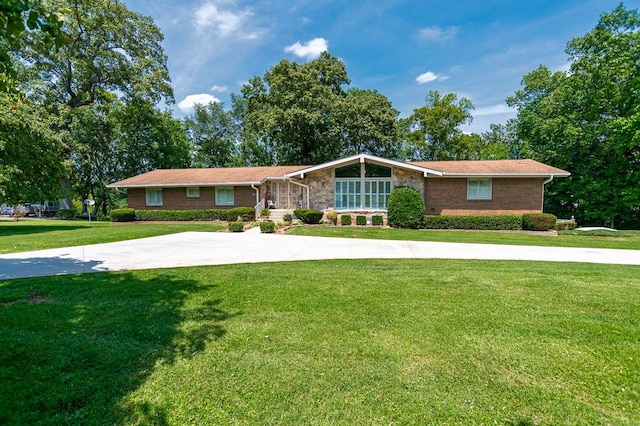 ranch-style house with a front lawn