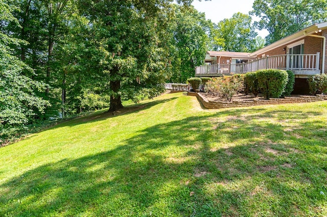 view of yard with a wooden deck