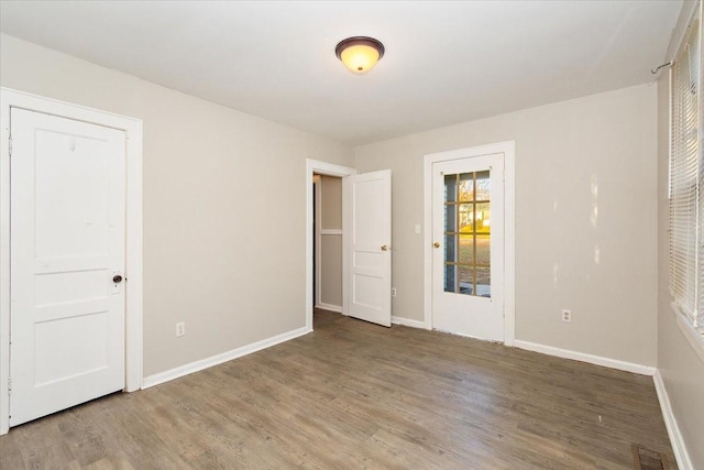 spare room featuring hardwood / wood-style floors