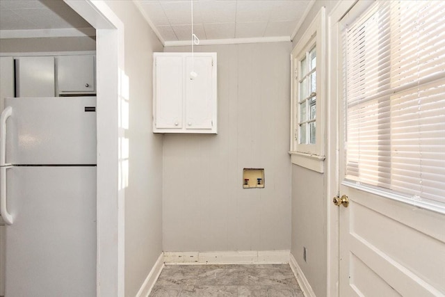 washroom featuring washer hookup and crown molding