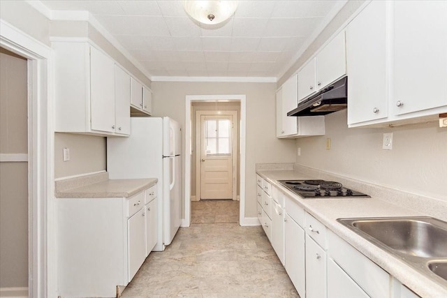 kitchen featuring ornamental molding, cooktop, sink, white refrigerator, and white cabinets