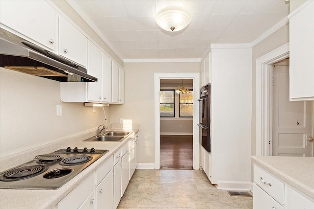 kitchen with black double oven, crown molding, sink, stainless steel stovetop, and white cabinetry