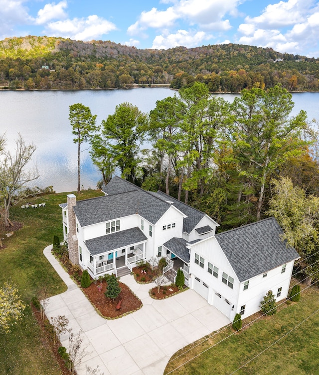 birds eye view of property featuring a water view