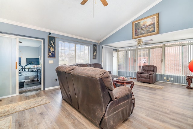 living room with ceiling fan, light hardwood / wood-style floors, lofted ceiling, and ornamental molding