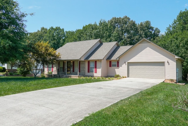 ranch-style house with a garage and a front lawn