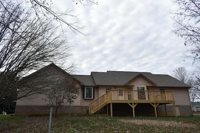 back of house with a wooden deck